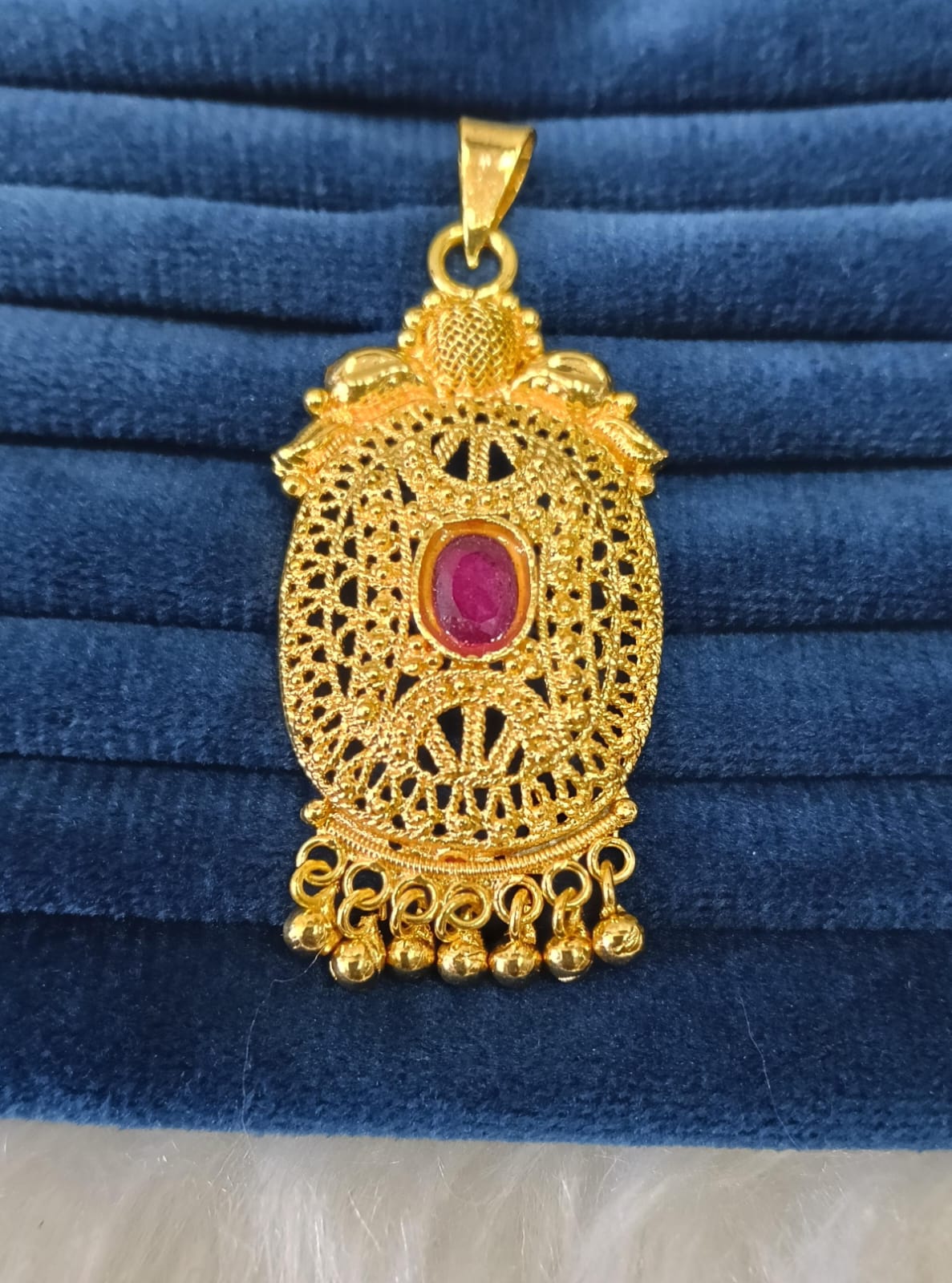 Gold plated pendant.