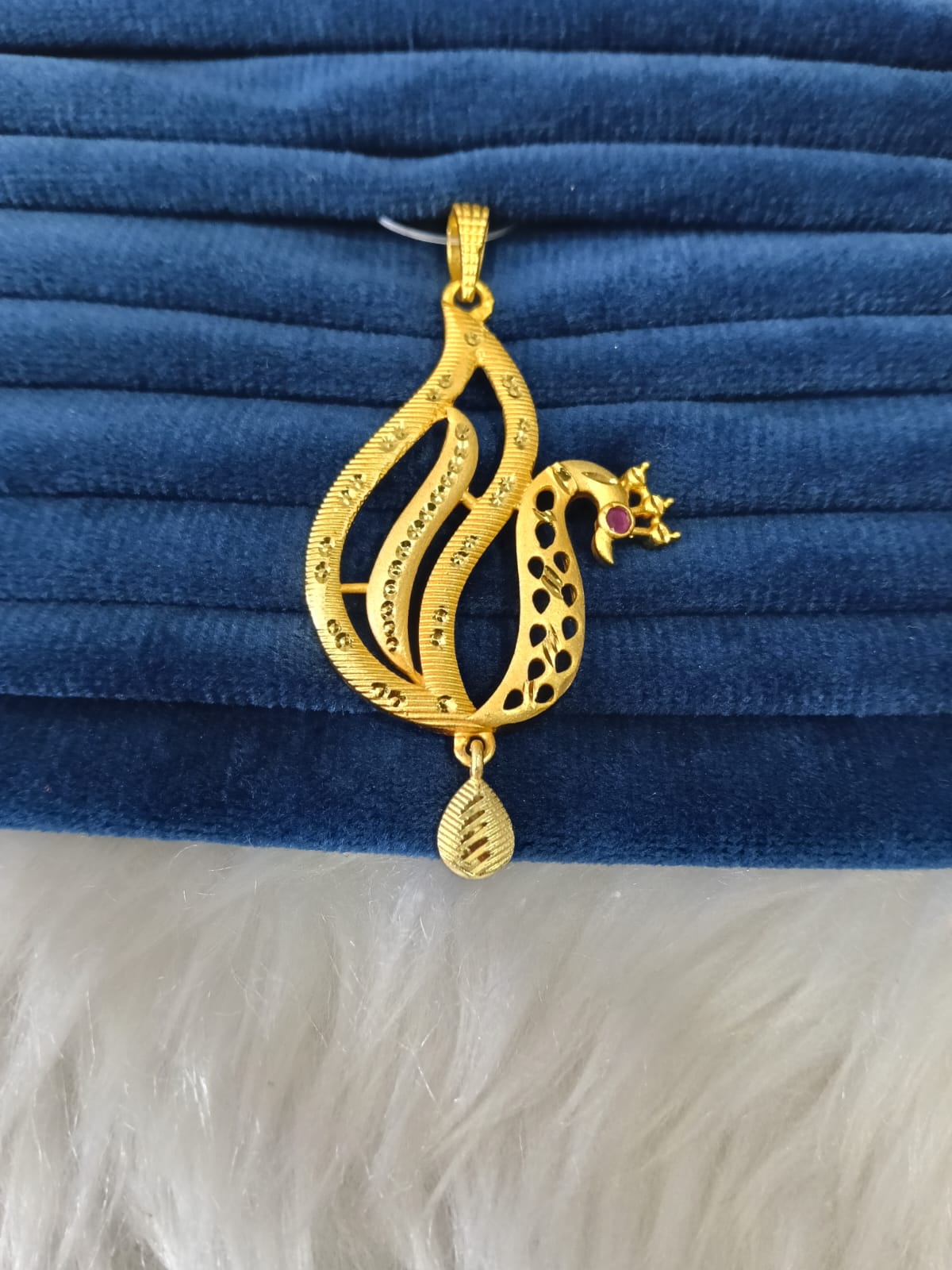 Gold plated pendant.