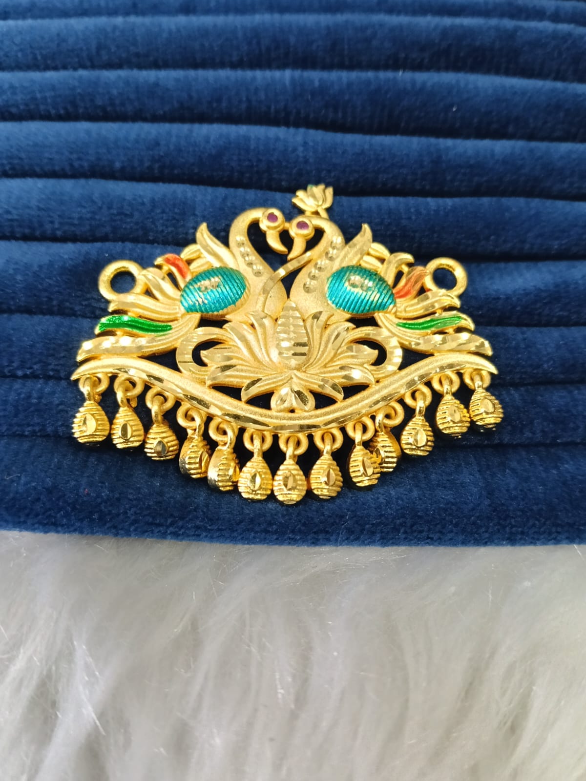 Gold plated pendant.