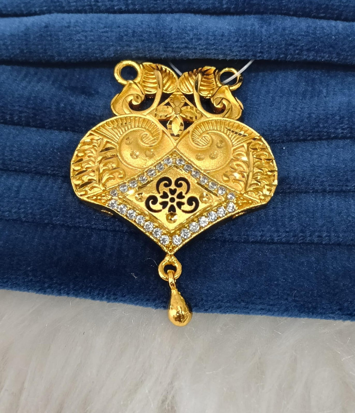 Gold plated pendant.