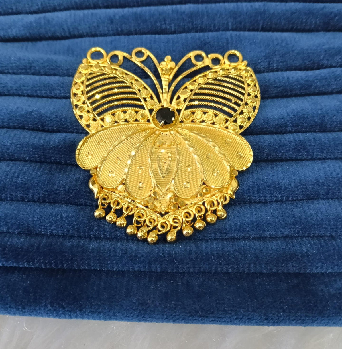 Gold plated pendant.