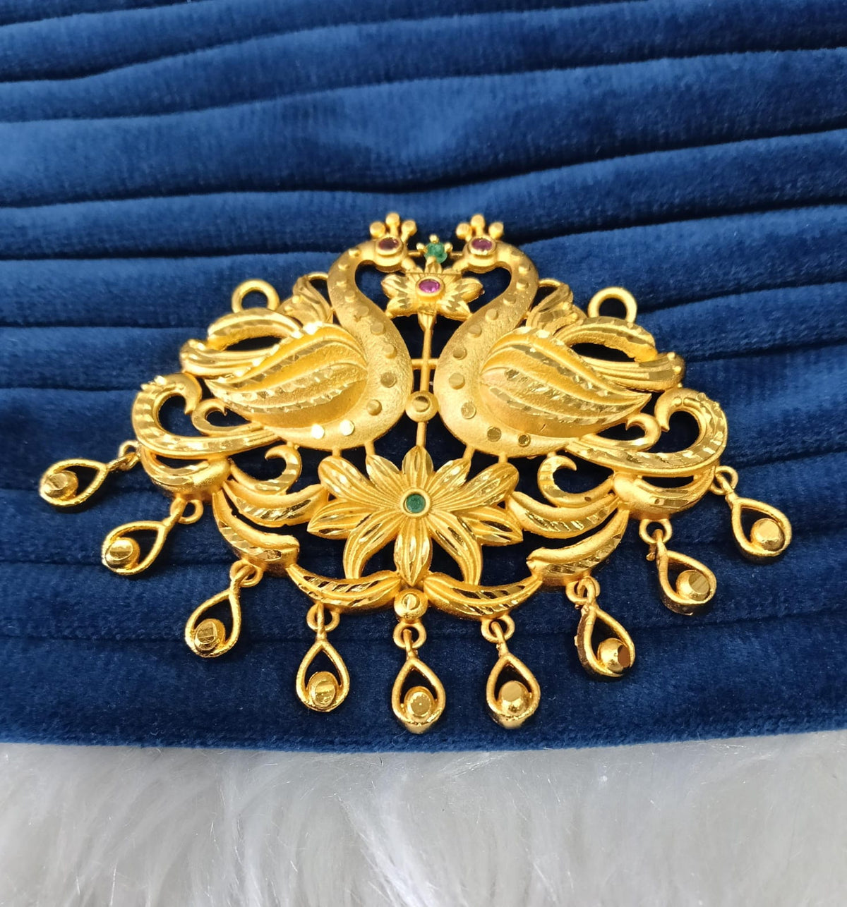 Gold plated pendant.