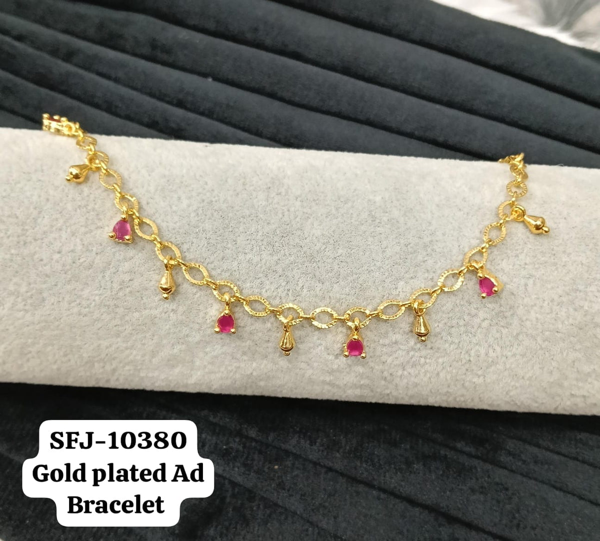 Gold plated AD bracelet.