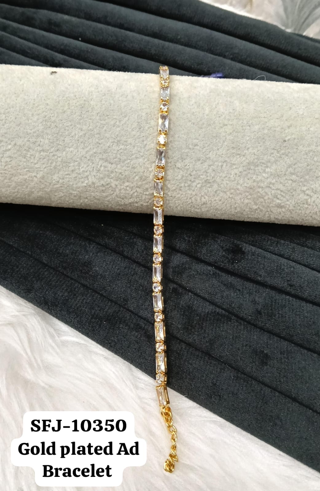 Gold plated AD bracelet.