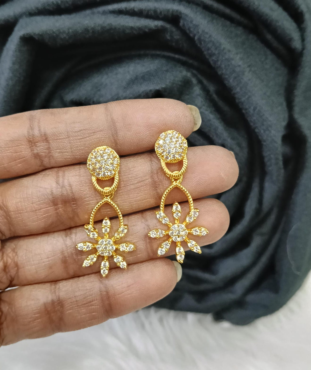 Gold plated Ad earing.