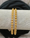 Gold plated bangle.