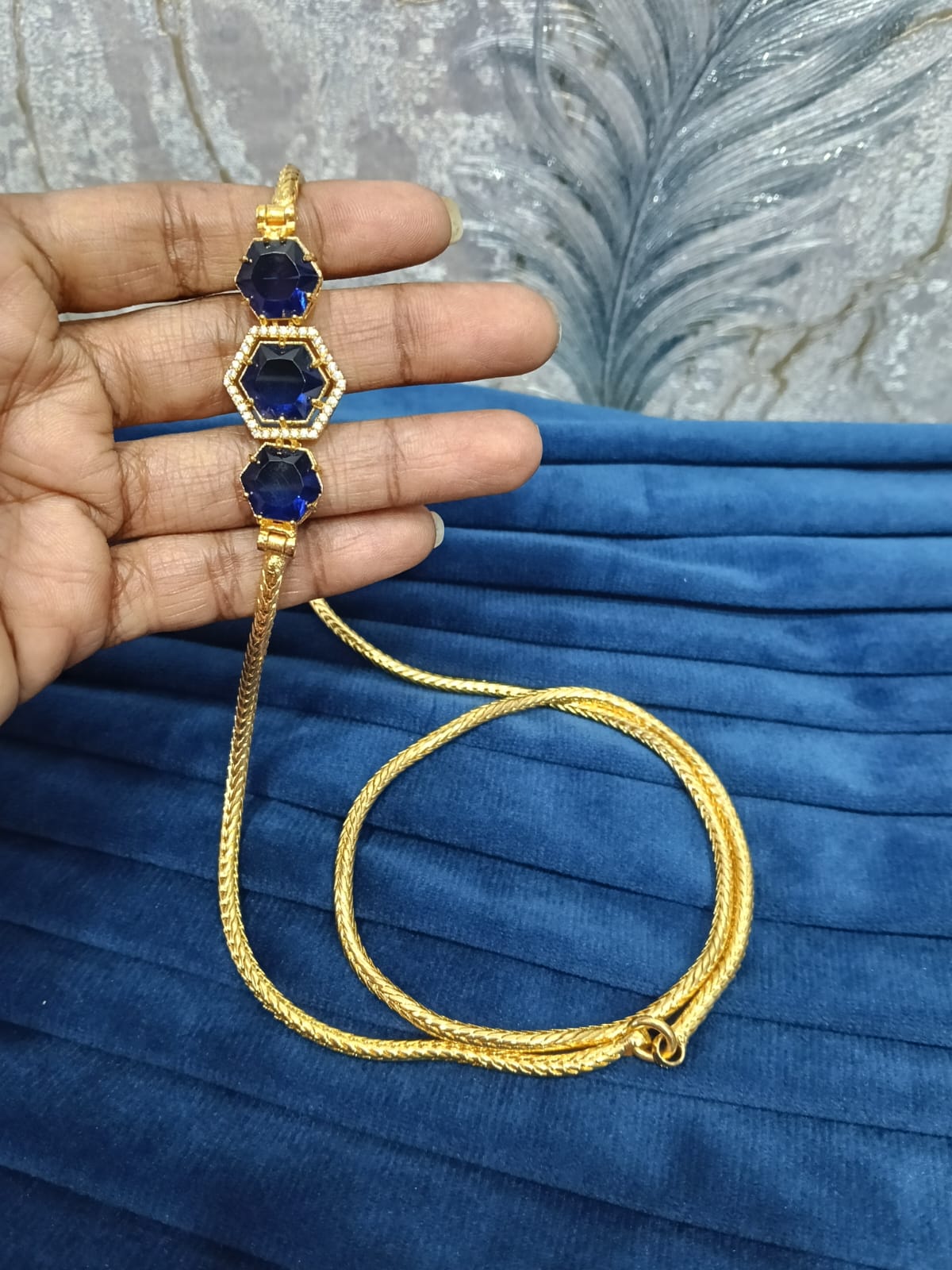 Gold look mugappu chain.
