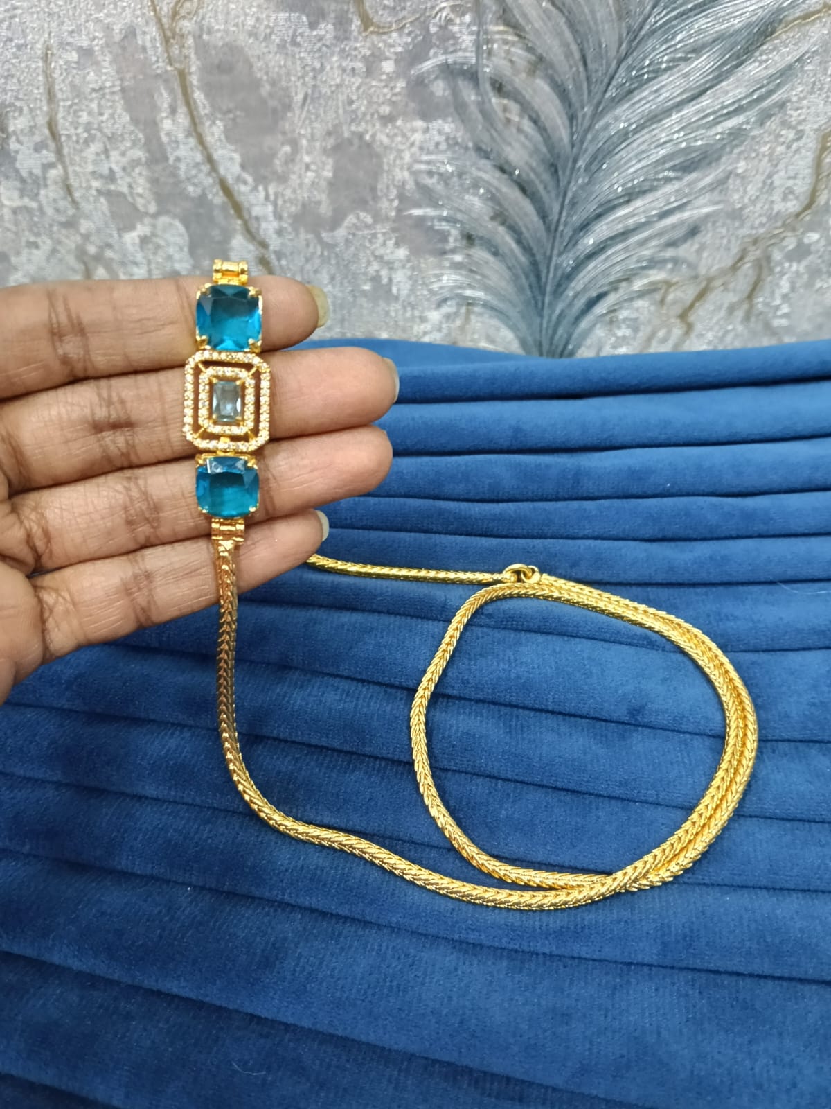 Gold look mugappu chain.