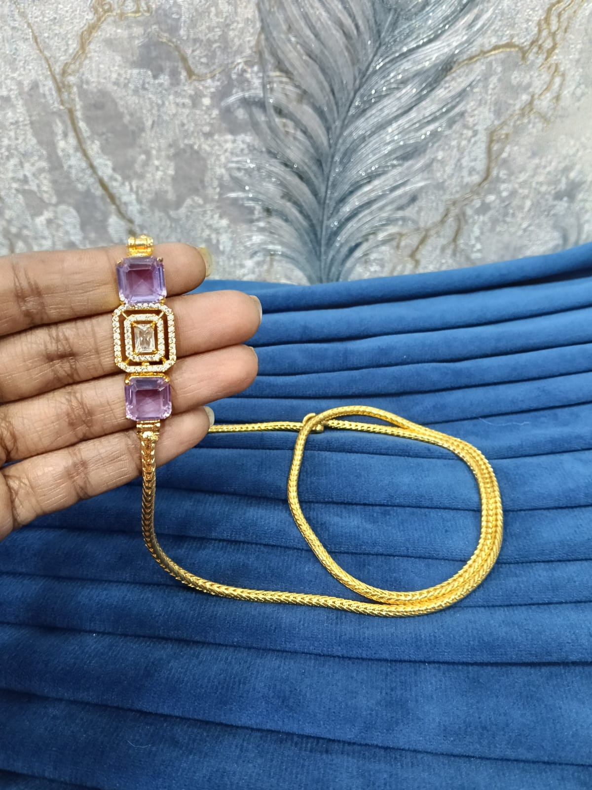 Gold look mugappu chain.