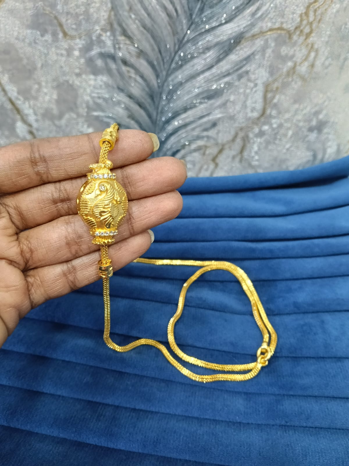 Gold look mugappu chain.