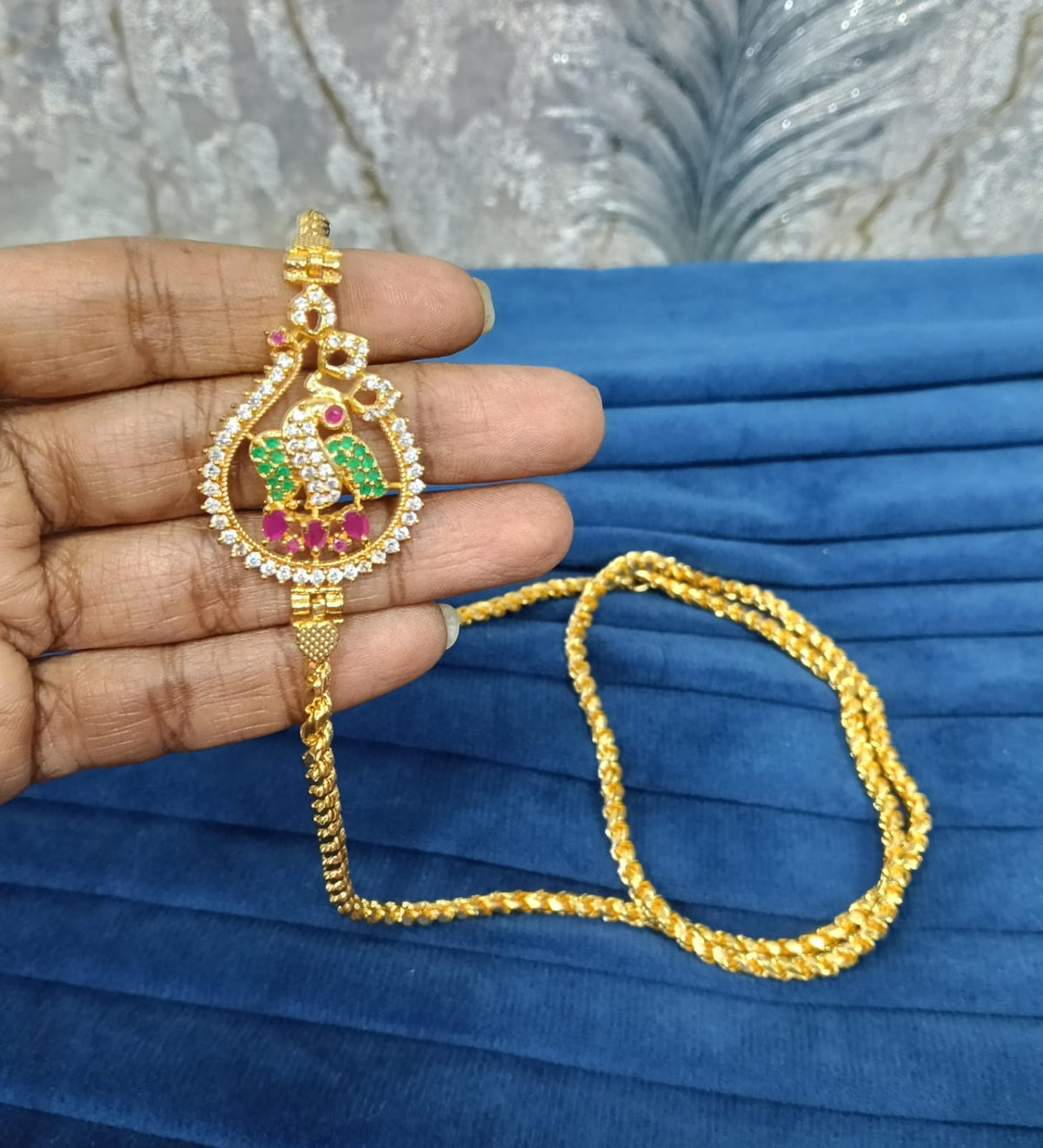 Gold look mugappu chain.