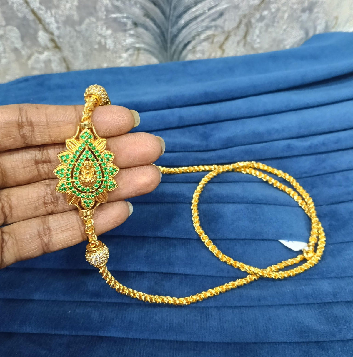 Gold look mugappu chian.