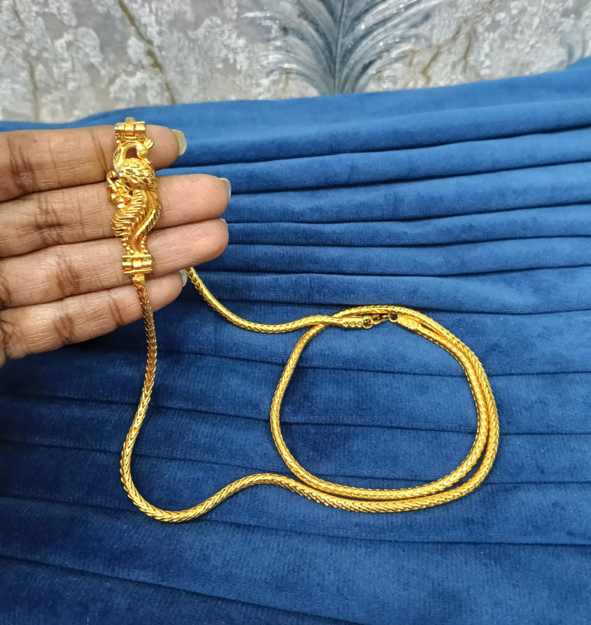 Gold look mugappu chain.
