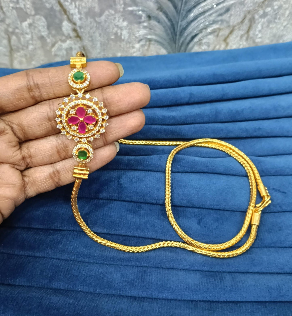 Gold look mugappu chain.