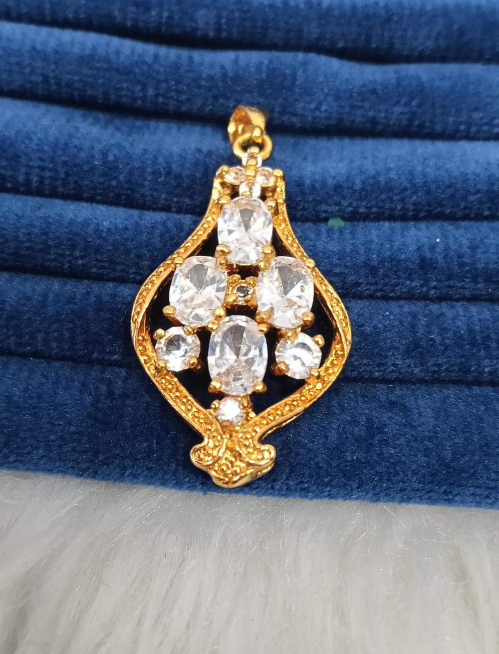 Gold plated pendant.