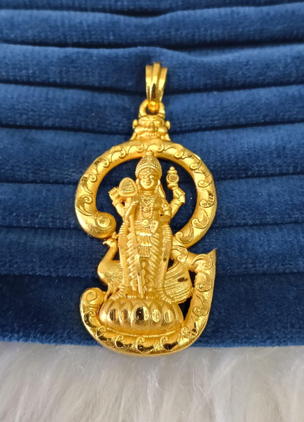 Gold plated pendant.