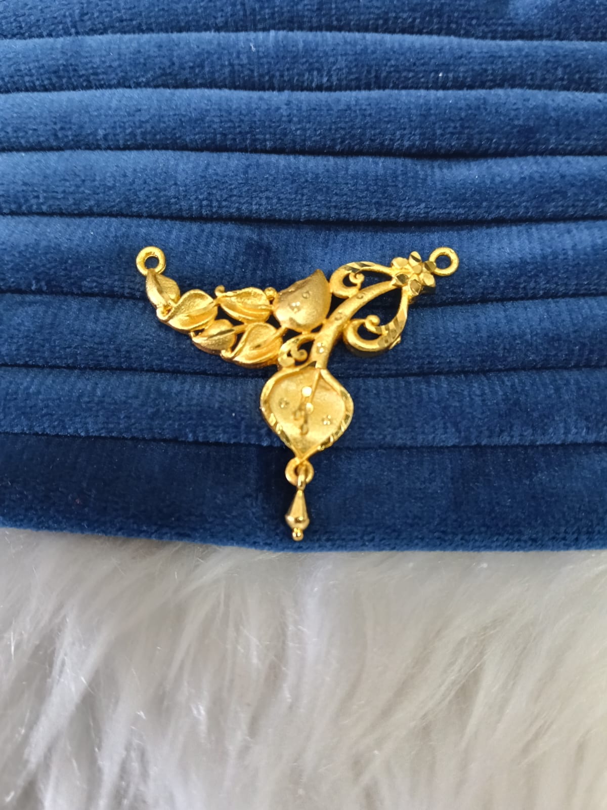 Gold plated pendant.