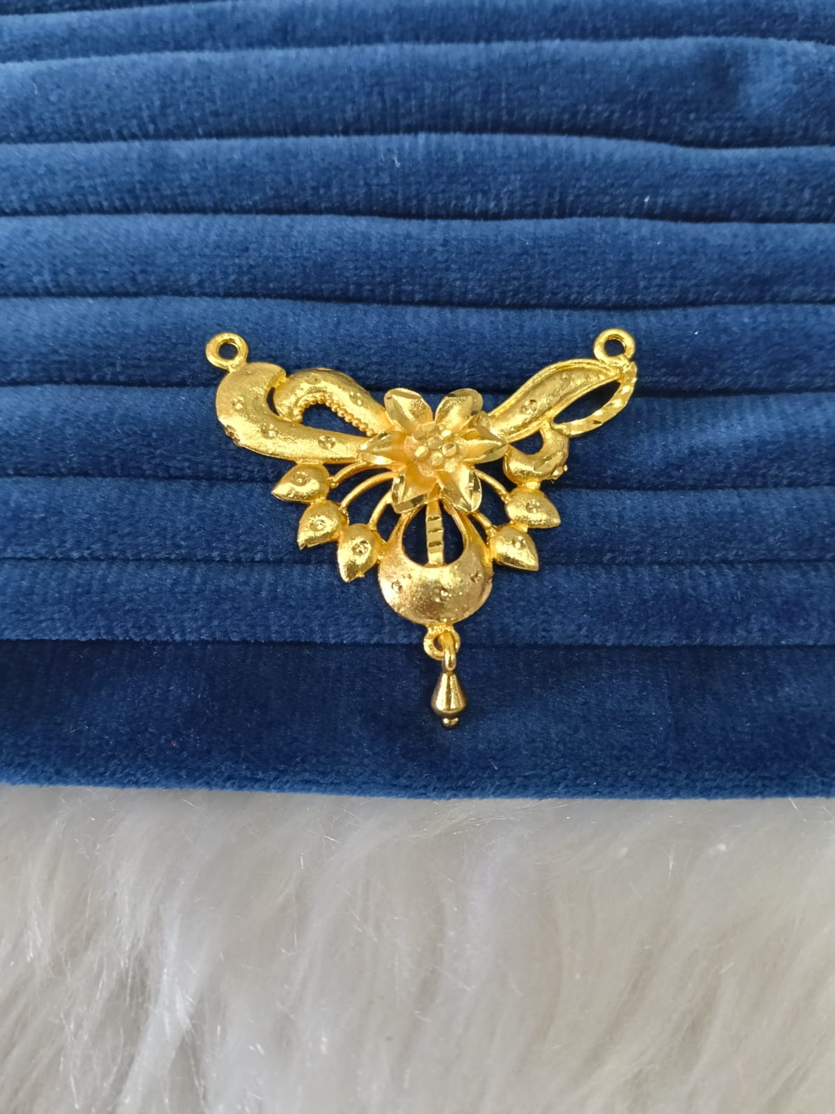Gold plated pendant.