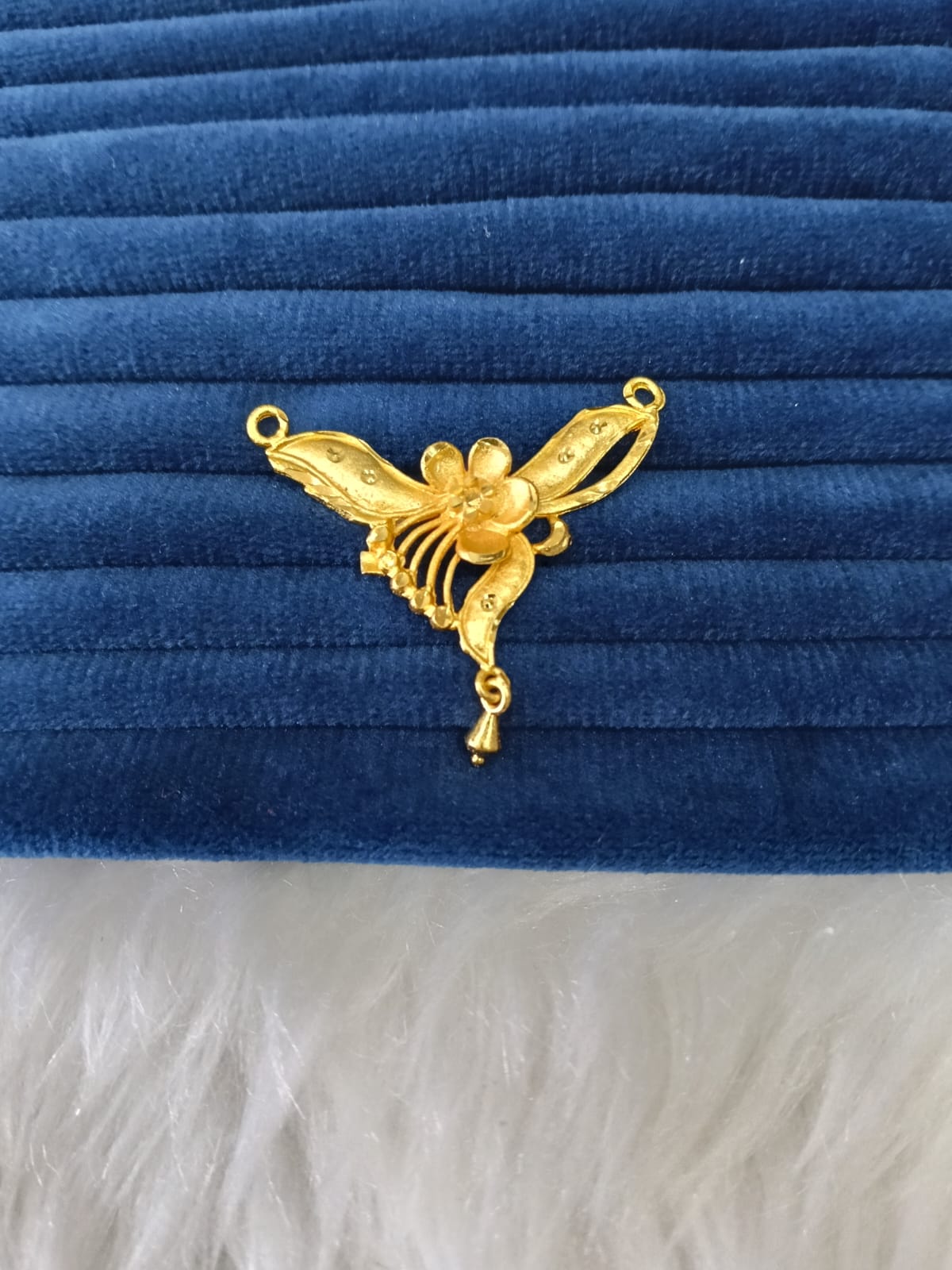 Gold plated pendant.