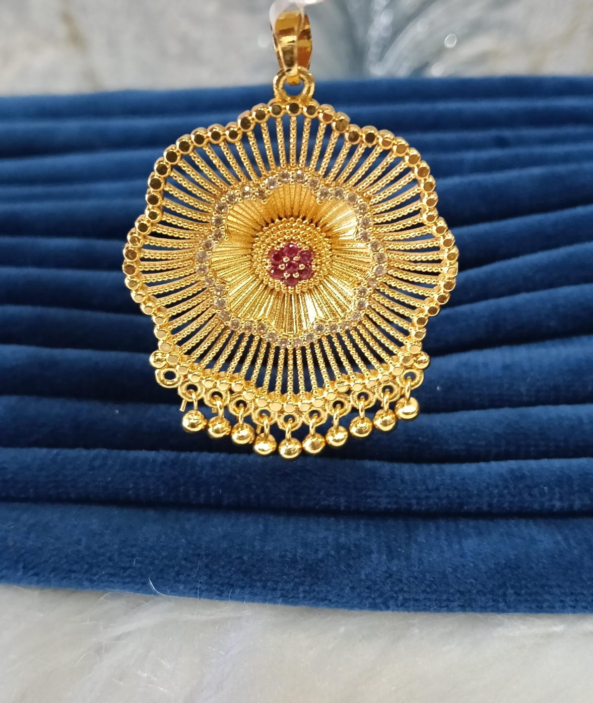 Gold plated pendant.