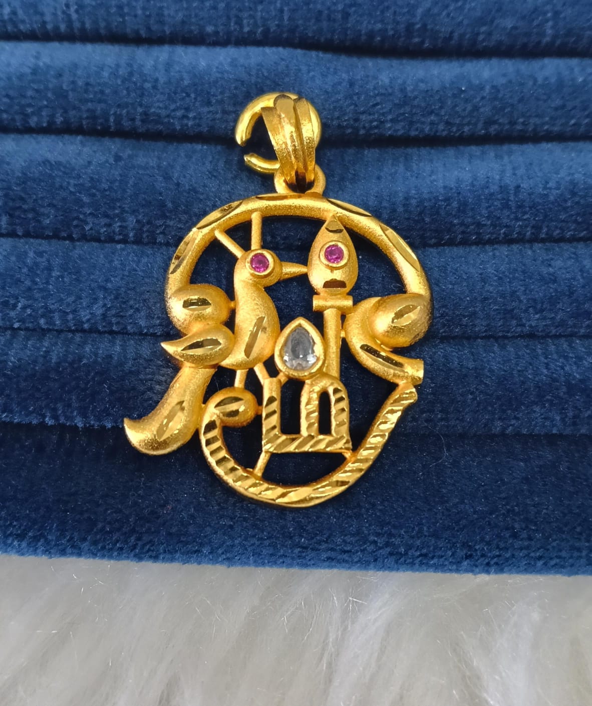Gold plated pendant.