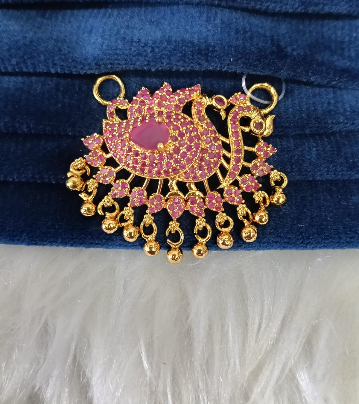 Gold plated pendant.