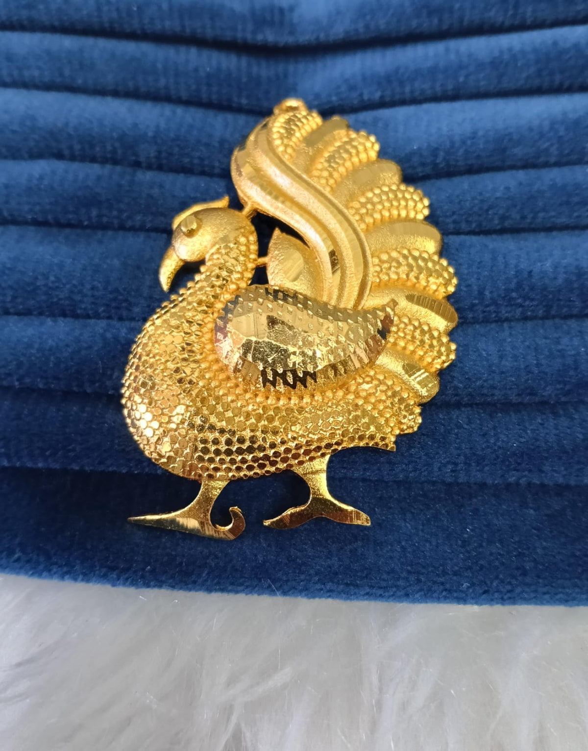 Gold plated pendant.