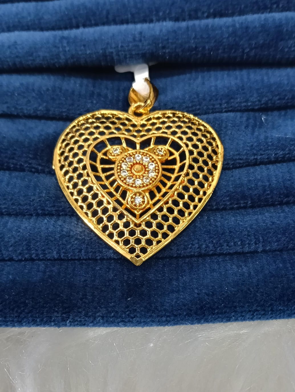 Gold plated pendant.