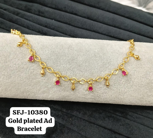Gold plated AD bracelet.