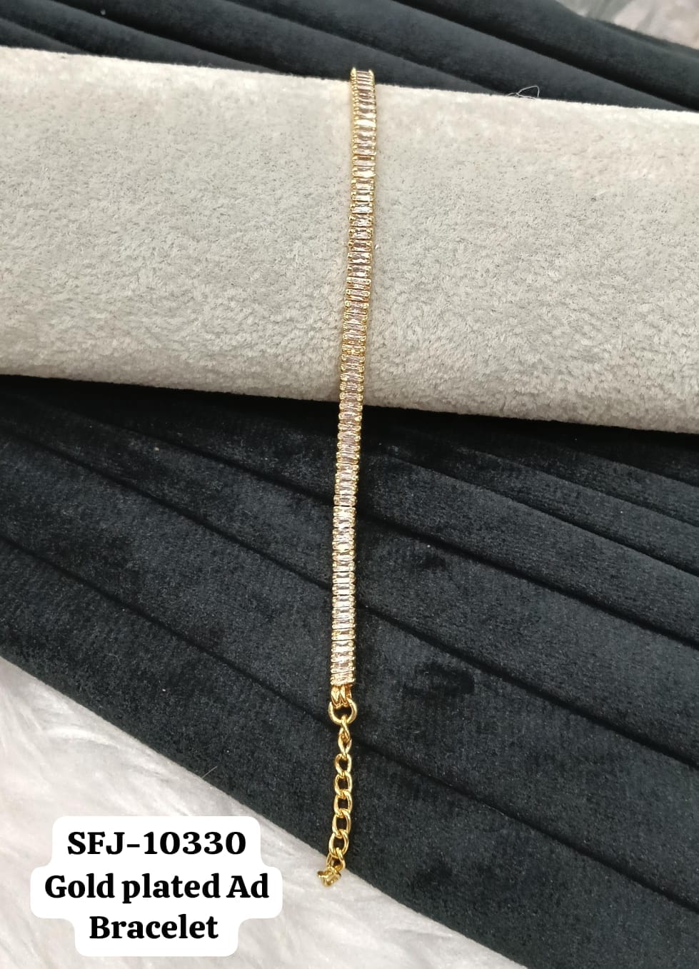 Gold plated AD bracelet.
