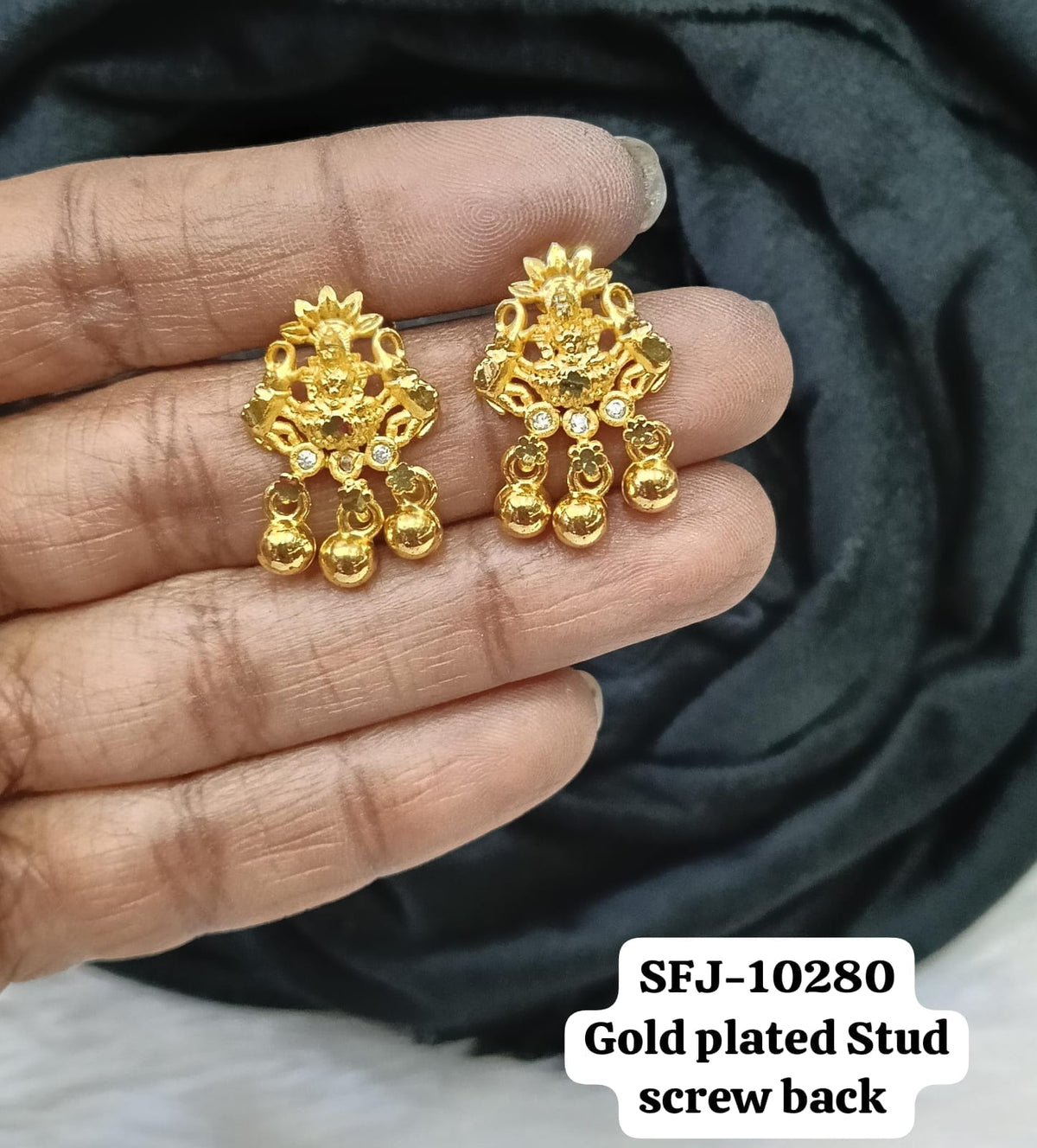 Gold plated stud.