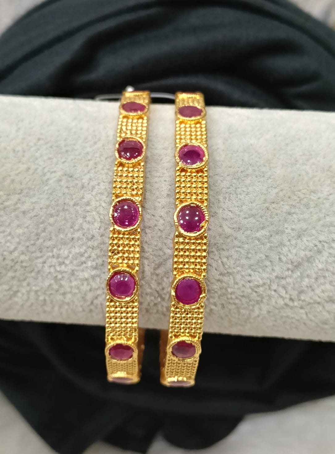 Gold plated bangle.