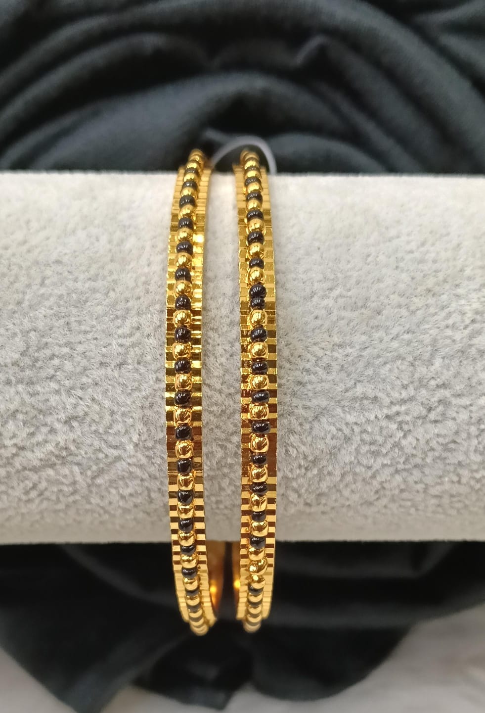 Gold plated bangle.