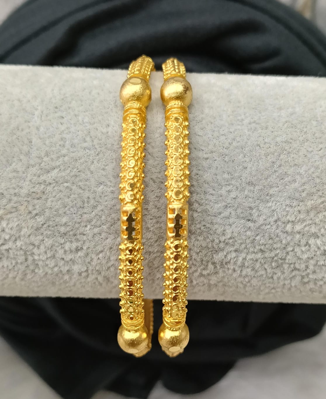 Gold plated bangle.