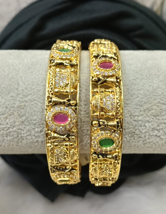 Gold plated bangle.
