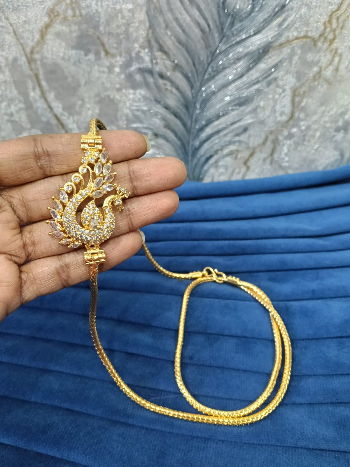 Gold look mugappu chain.
