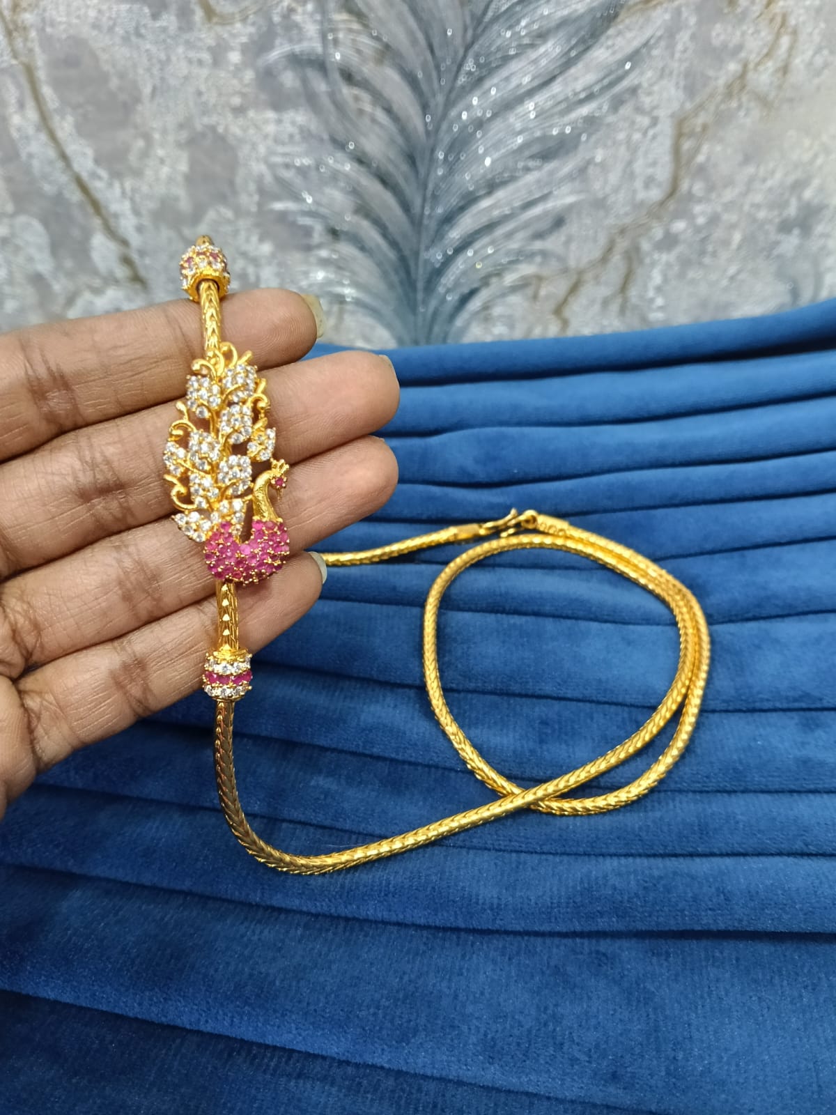 Gold look mugappu chain.