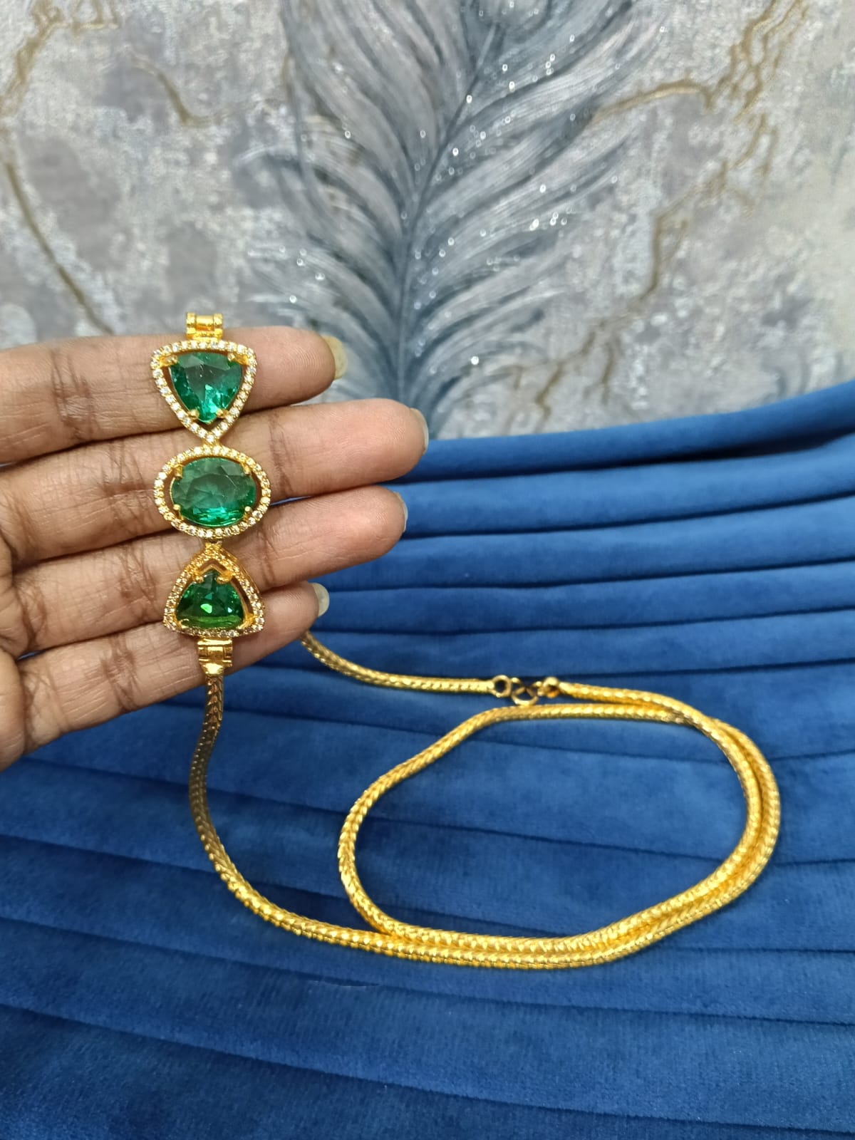 Gold look mugappu chain.