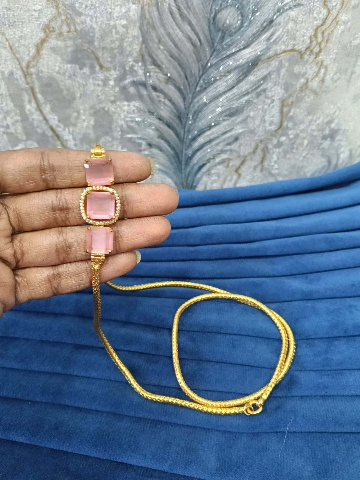 Gold look mugappu chain.