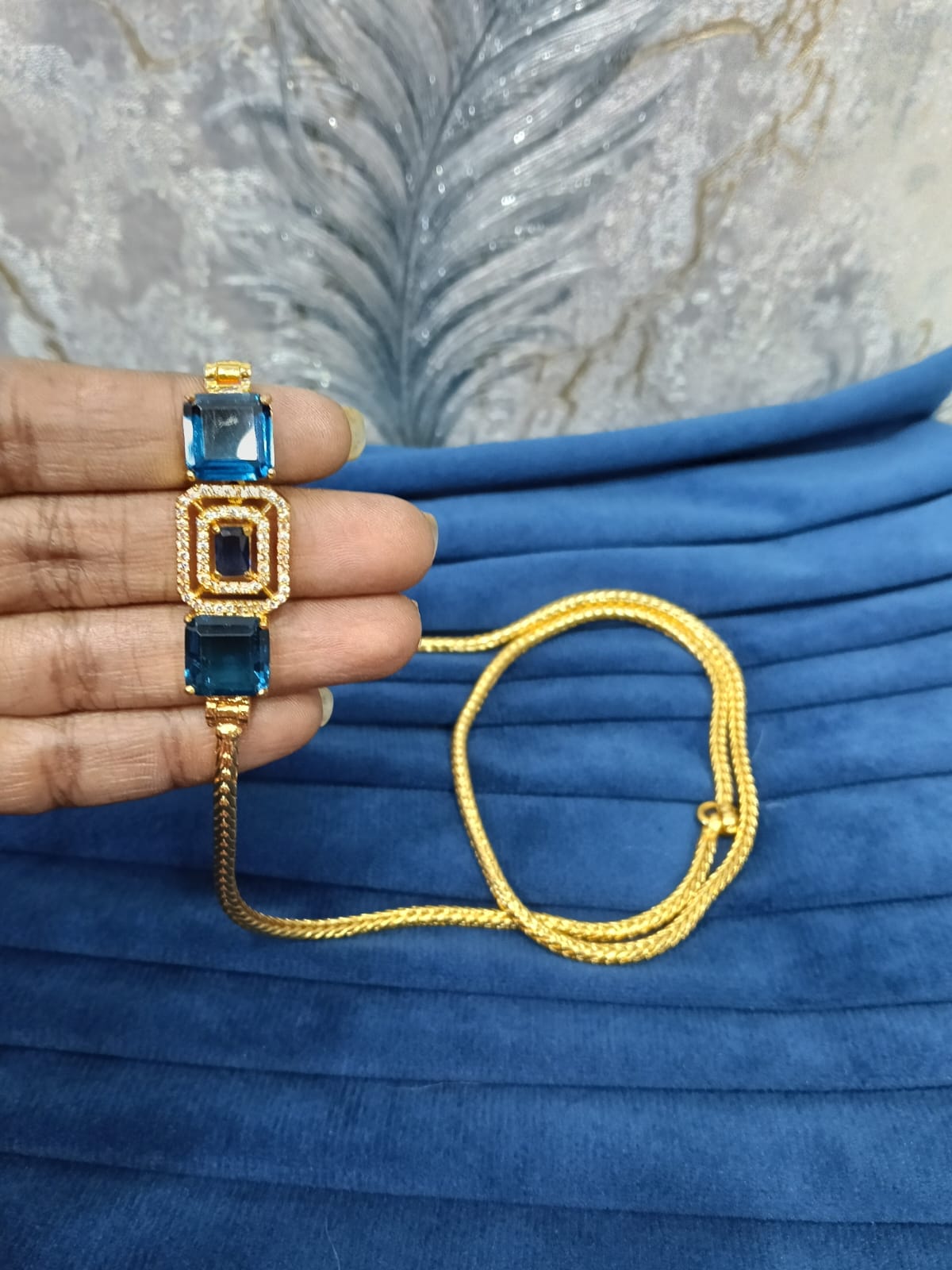 Gold look mugappu chain.