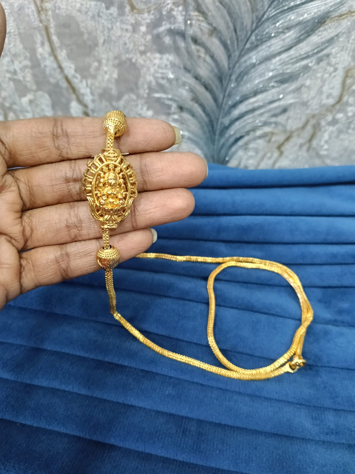 Gold look mugappu chain.