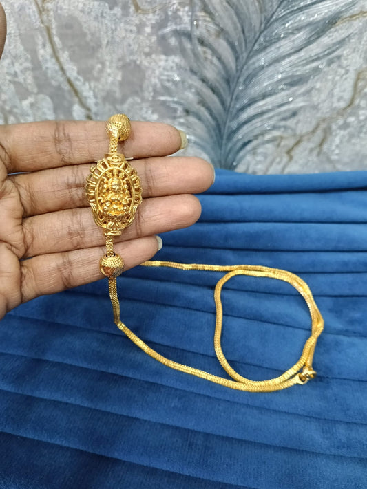Gold look mugappu chain.