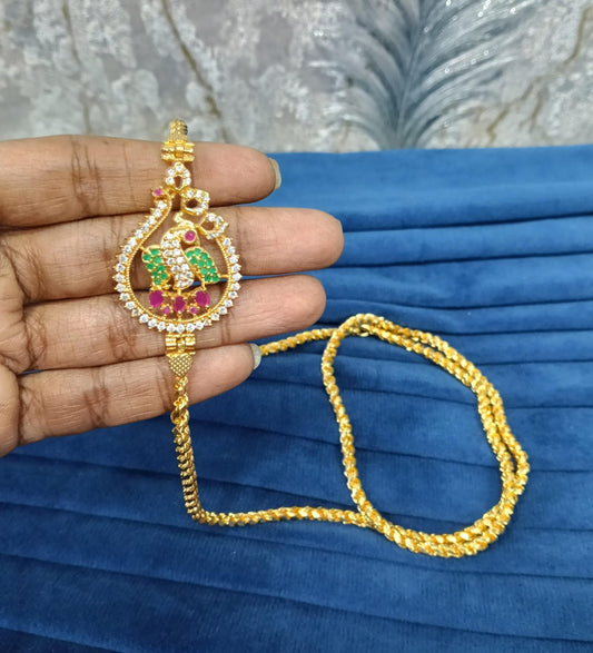 Gold look mugappu chain.