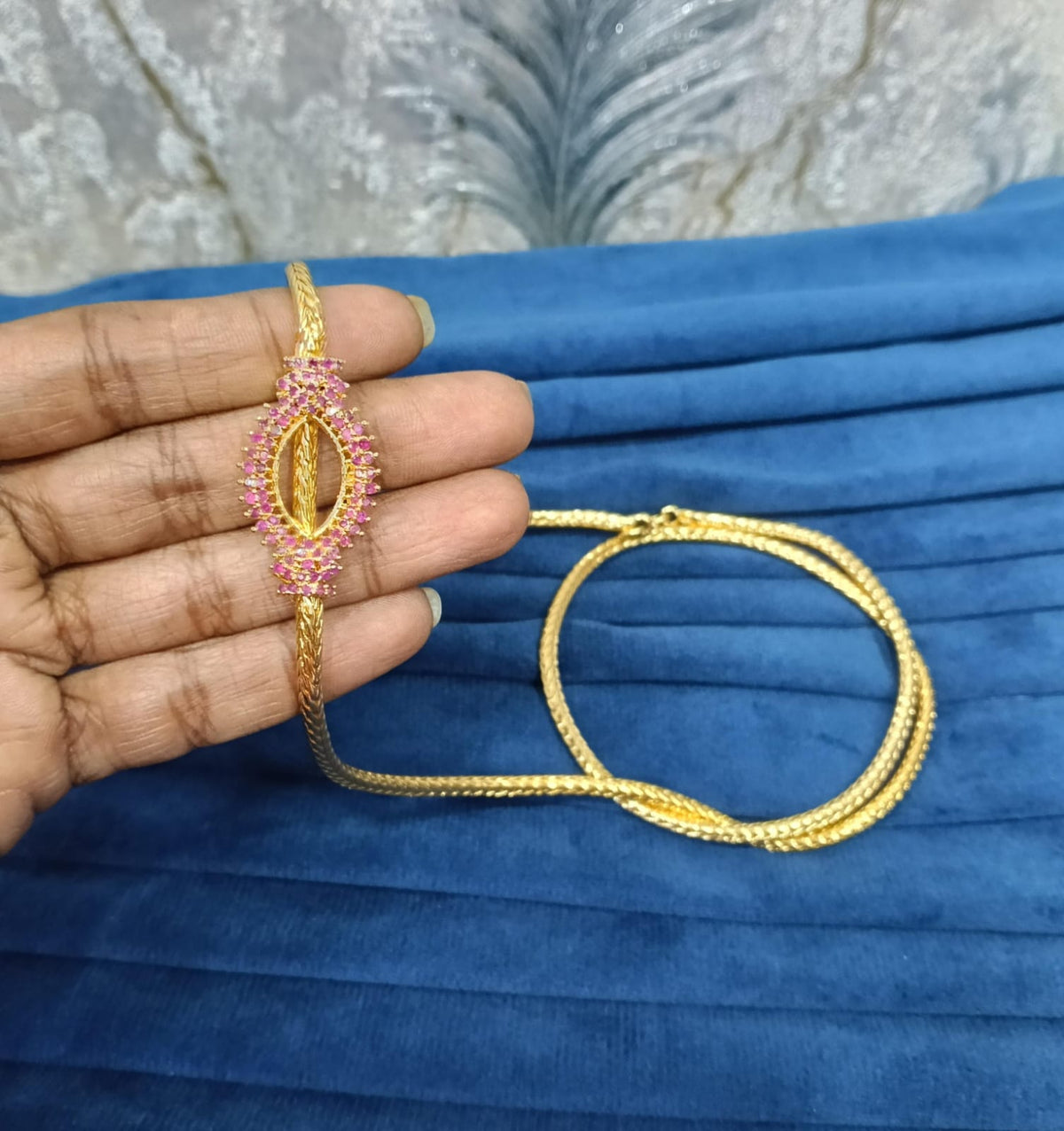 Gold look mugappu chain.